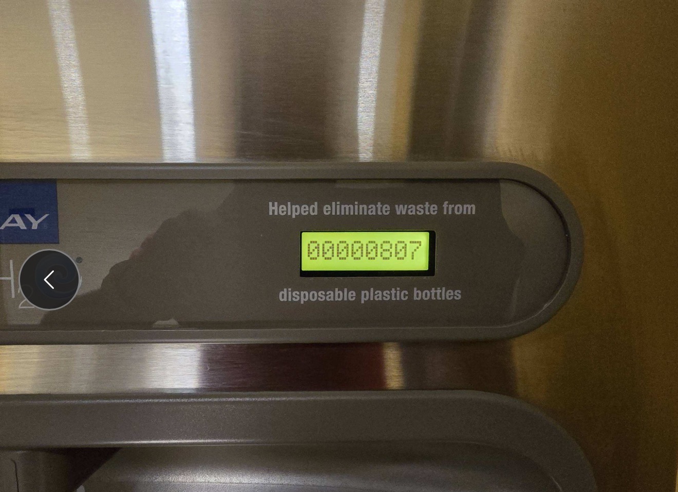 Close-up of the Green Ticker display showing 887 disposable plastic bottles saved